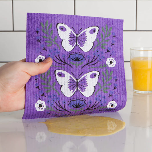 butterfly themed swedish dish cloth with a purple background