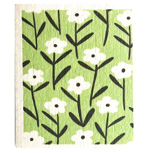 light green swedish dish cloth with white and black daisies